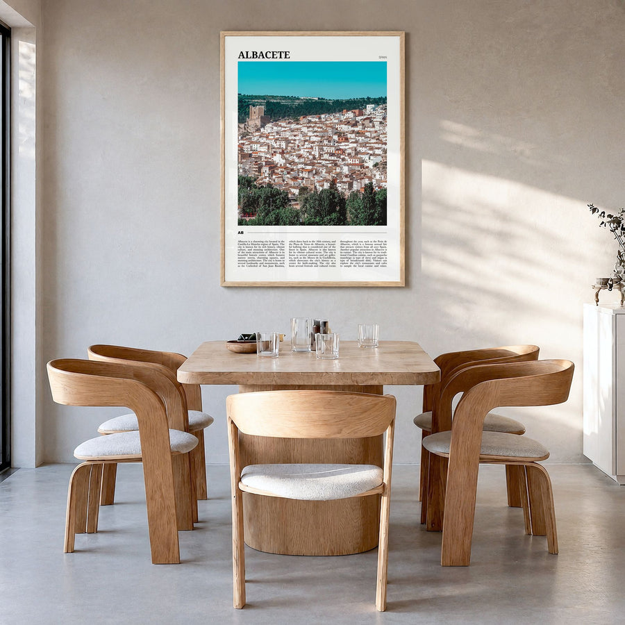 Albacete Travel Poster in a natural wood frame, hanging in a dining room