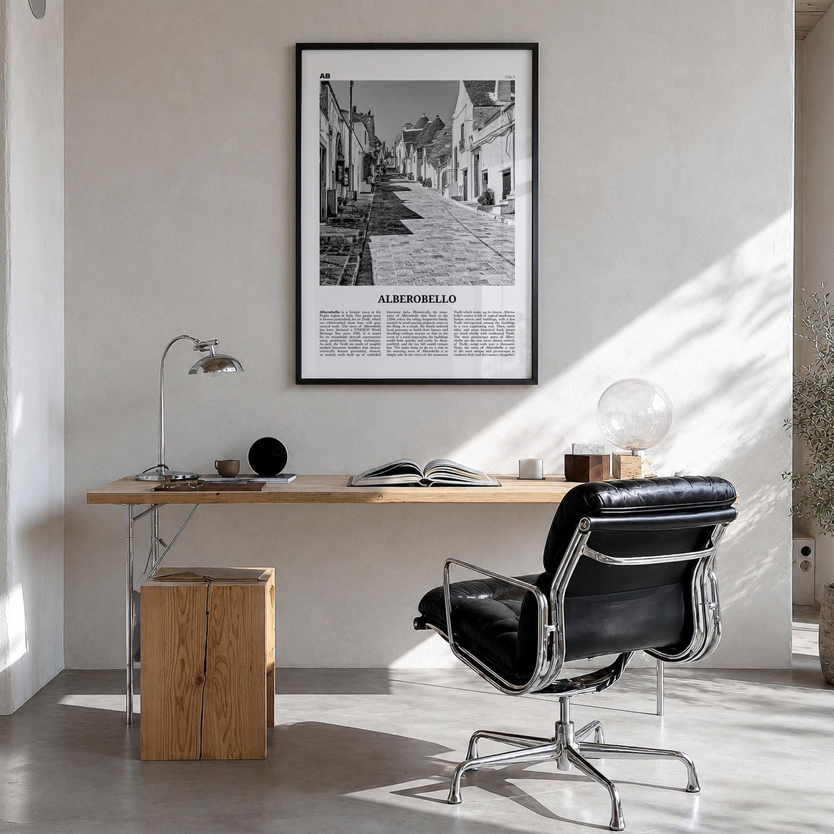 Alberobello black & white newspaper poster of Italy – vertical wall art in black wood frame, hanging on wall