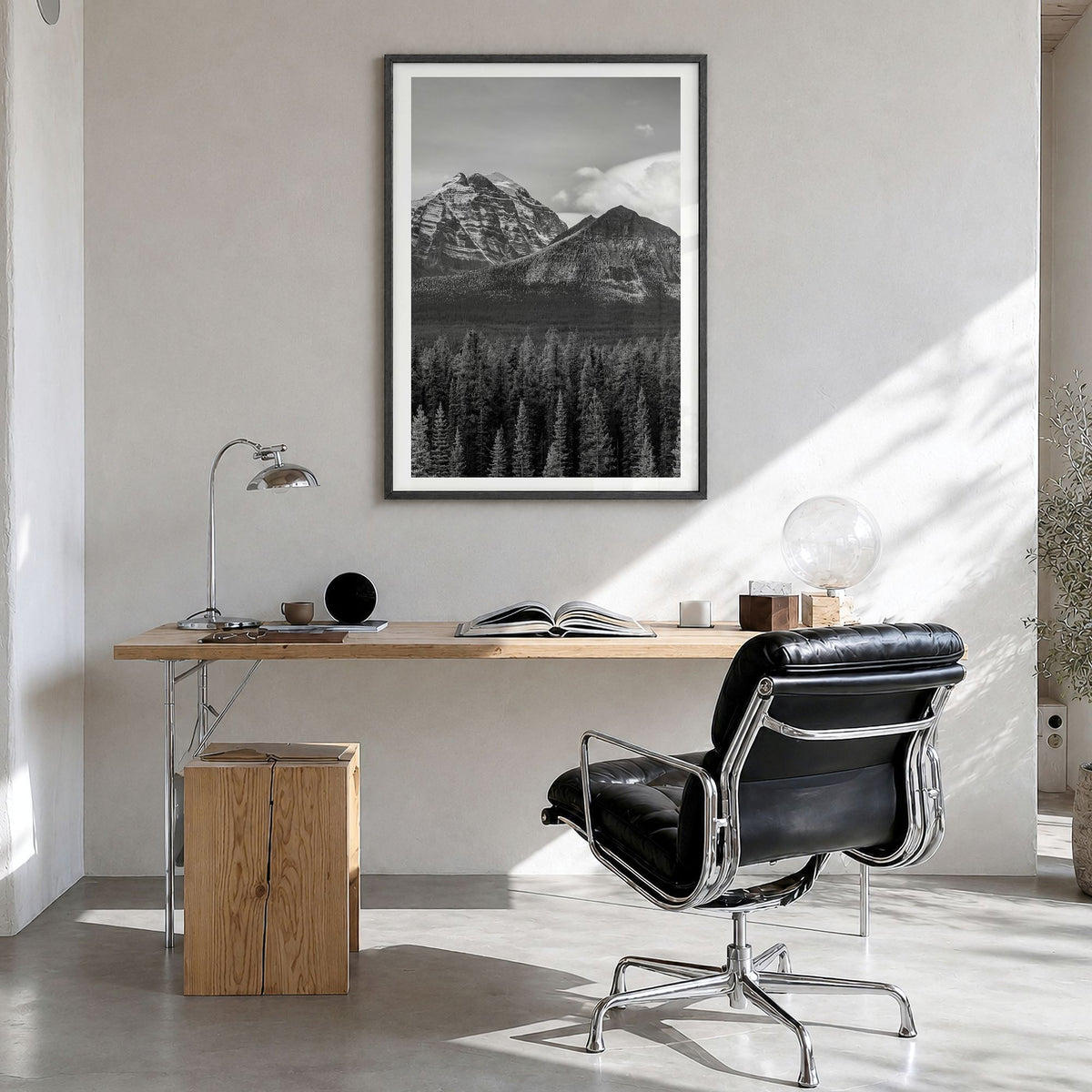 Alberta Photo Poster in a black wood frame, hanging in a bright home office, white border