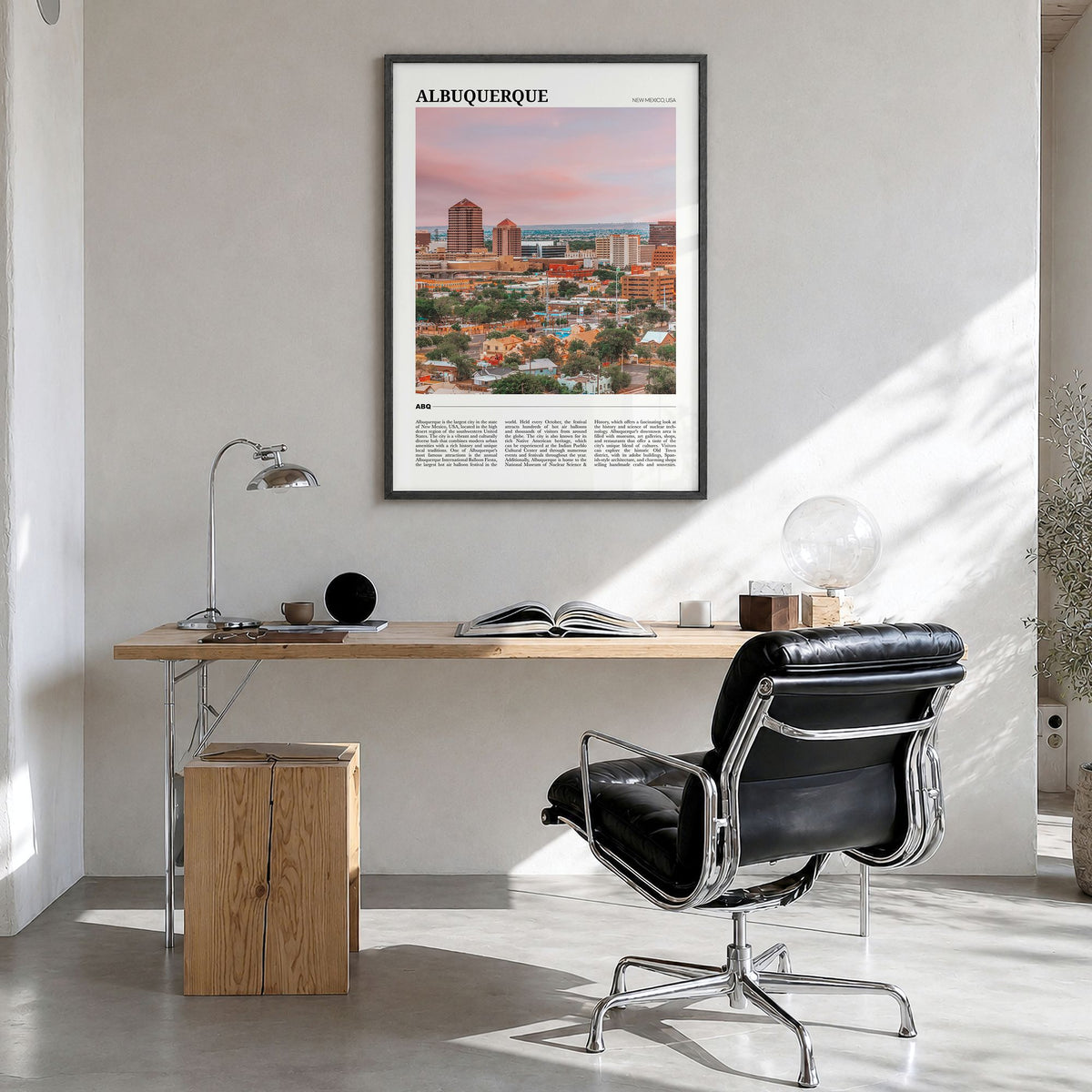 Albuquerque Travel Poster in a black wood frame, hanging in a bright home office