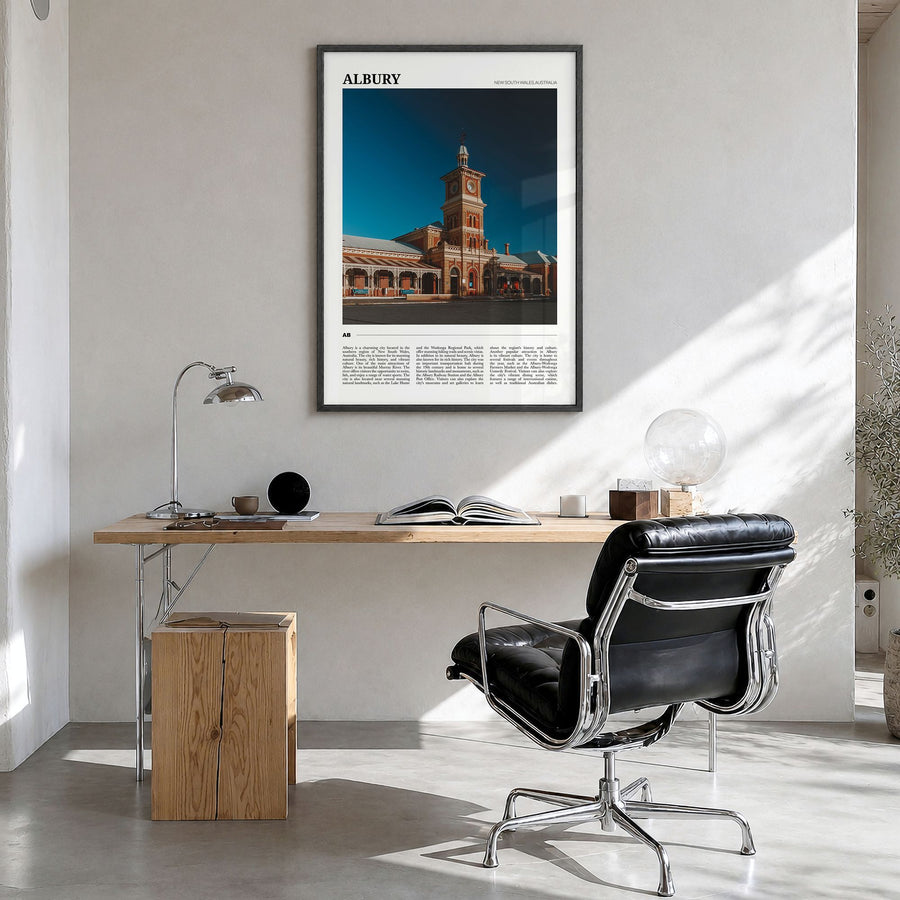 Albury Travel Poster in a black wood frame, hanging in a bright home office