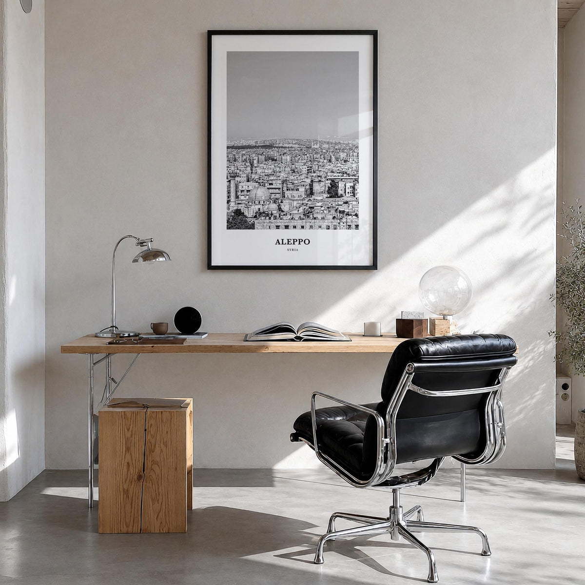 Aleppo black & white classic poster of Syria – vertical wall art in black wood frame, hanging on wall