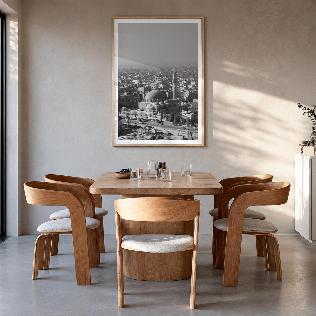 Aleppo black & white photo poster of Syria – vertical wall art in natural wood frame with white border, hanging on wall