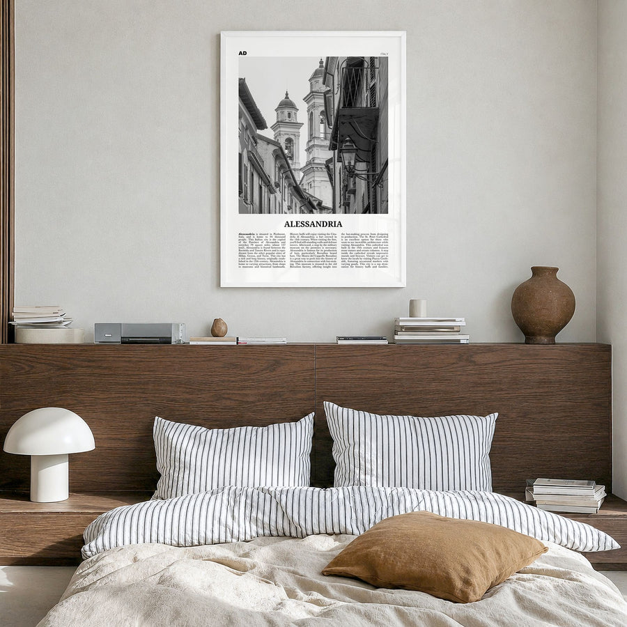 Alessandria Newspaper Poster in a white wood frame, hanging in a bedroom