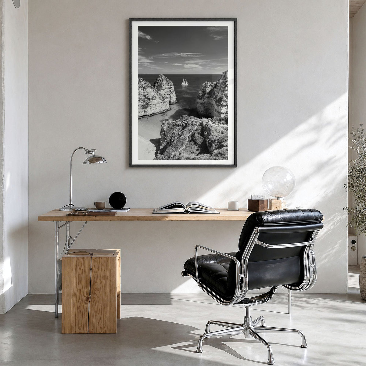 Algarve Photo Poster in a black wood frame, hanging in a bright home office, white border