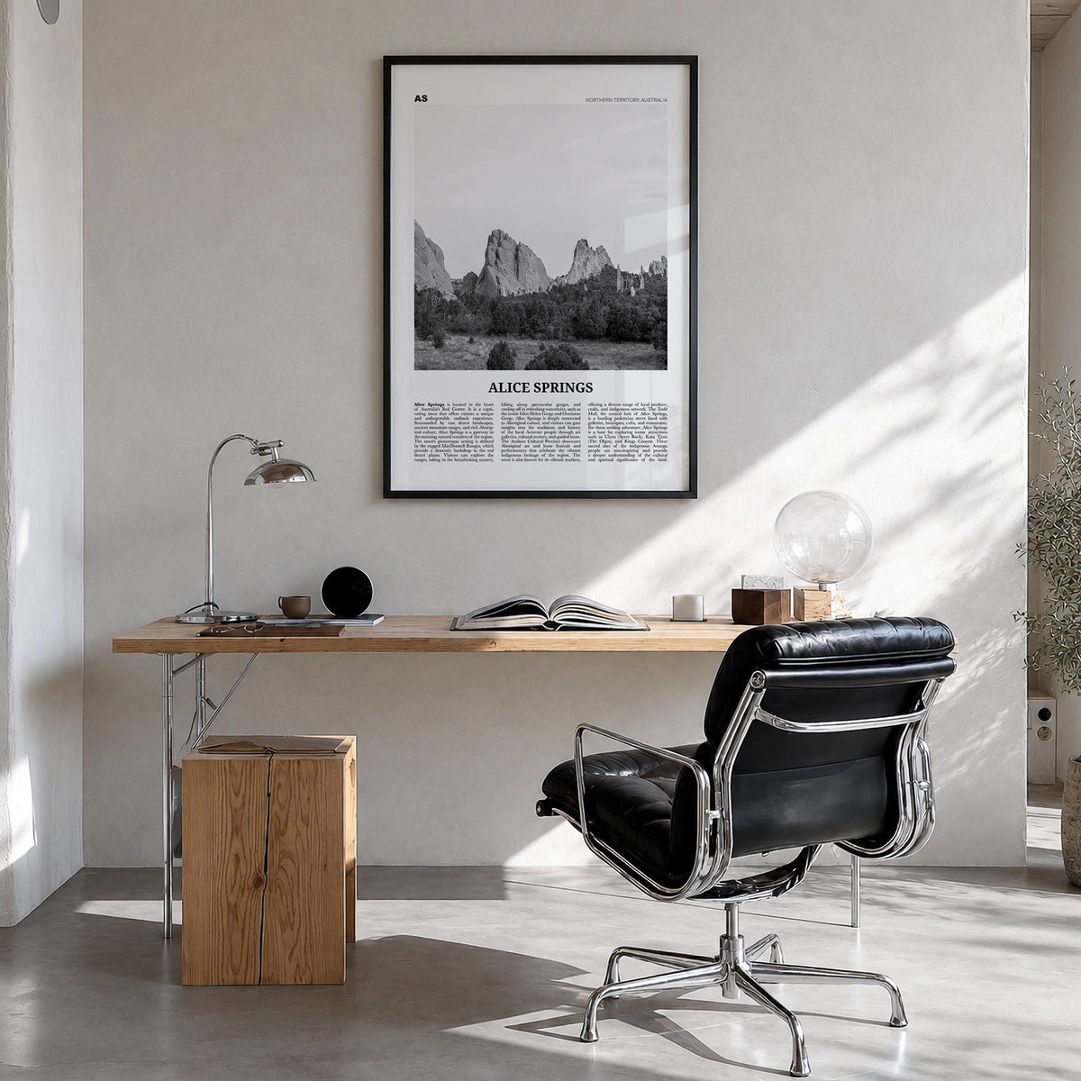 Alice Springs black & white newspaper poster of Australia – vertical wall art in black wood frame, hanging on wall