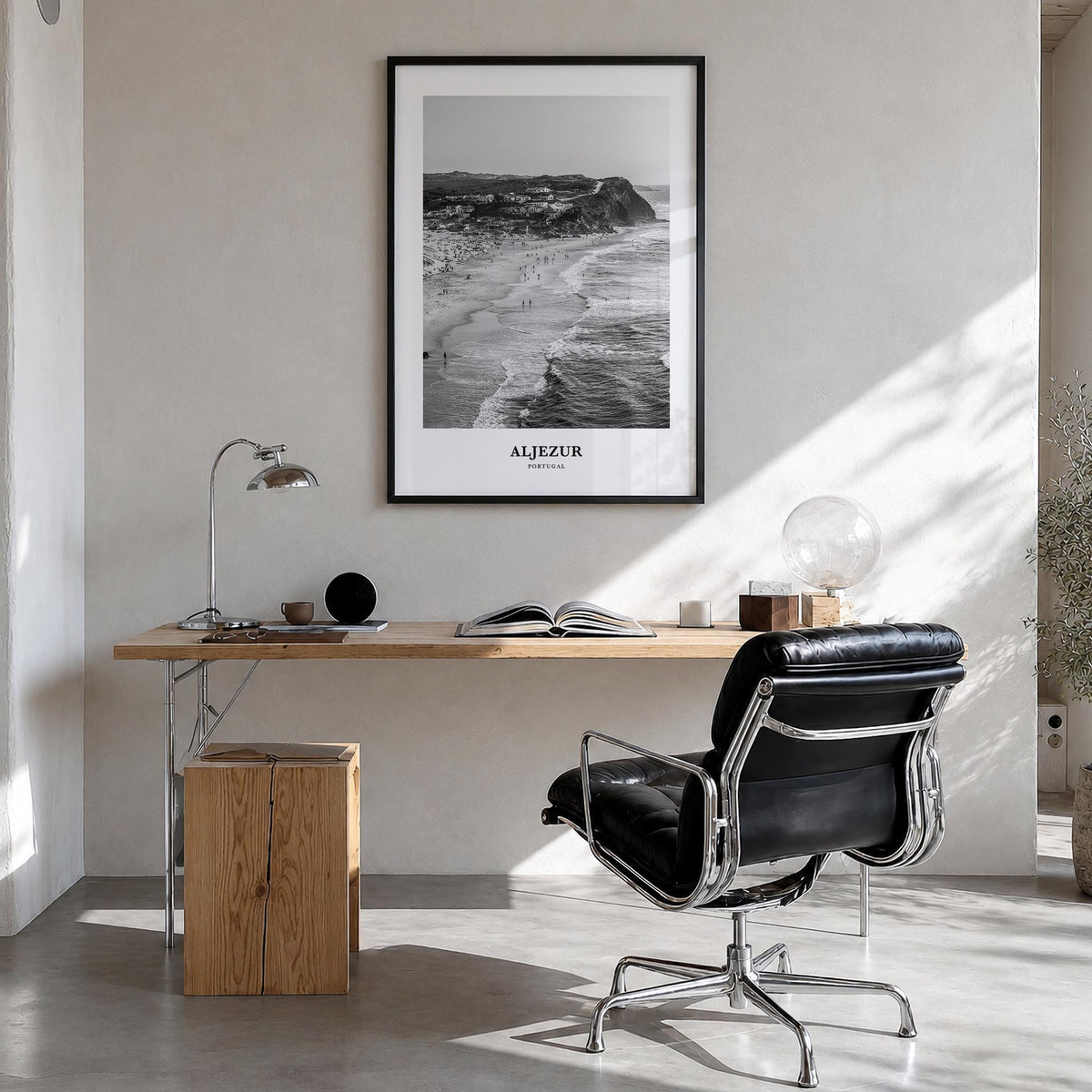 Aljezur black & white classic poster of Portugal – vertical wall art in black wood frame, hanging on wall