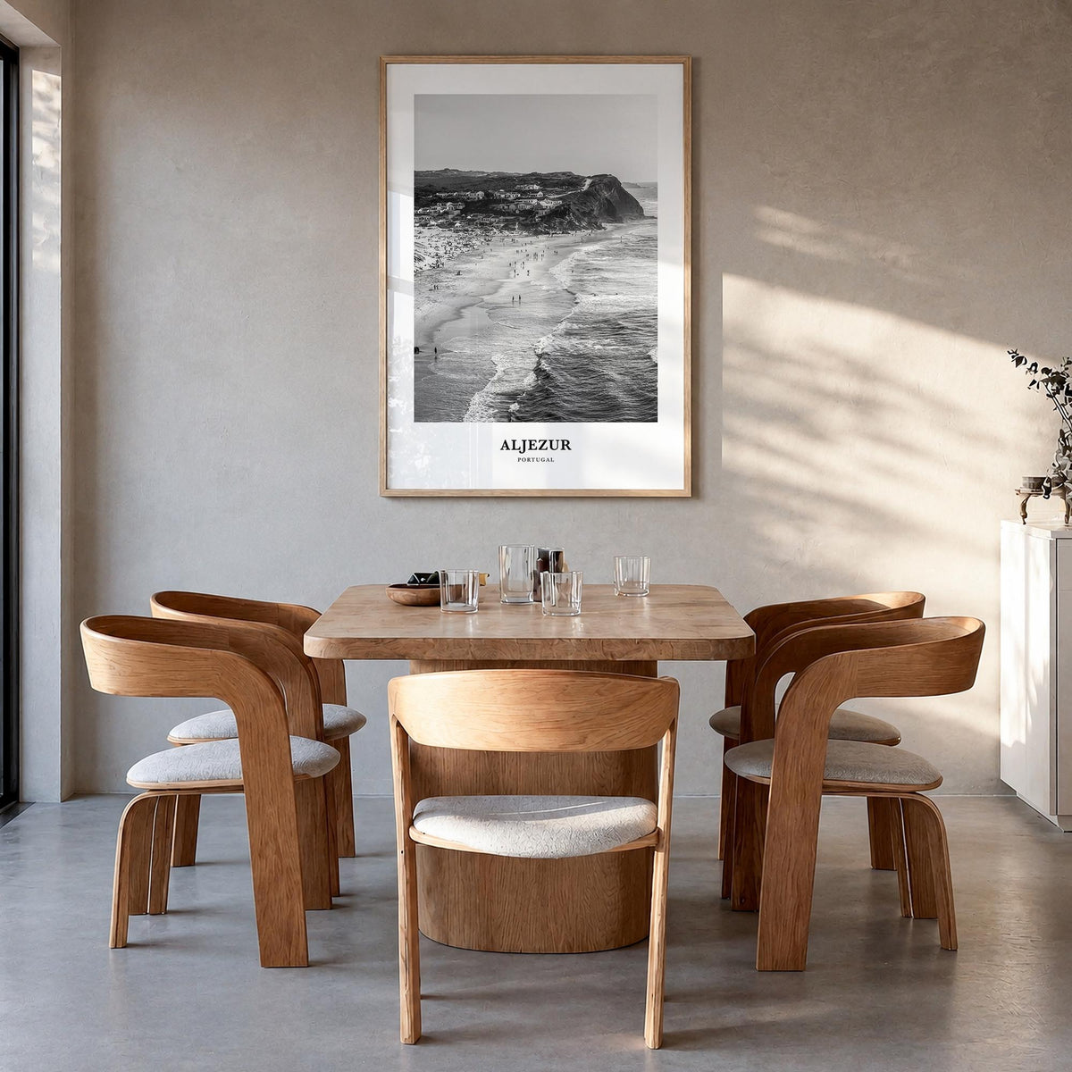 Aljezur black & white classic poster of Portugal – vertical wall art in natural wood frame, hanging on wall