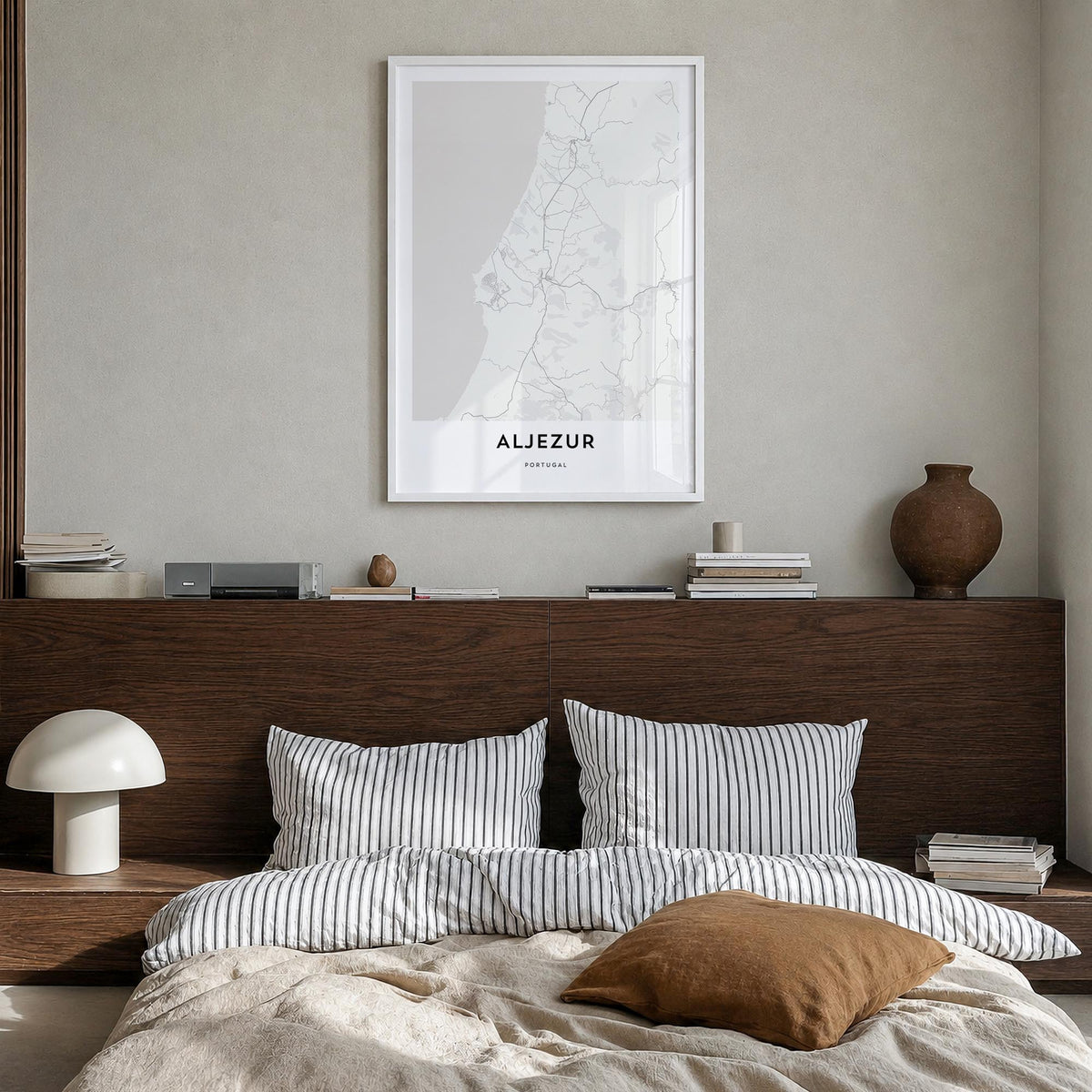 Aljezur black & white map poster of Portugal – vertical wall art in white wood frame, hanging on wall