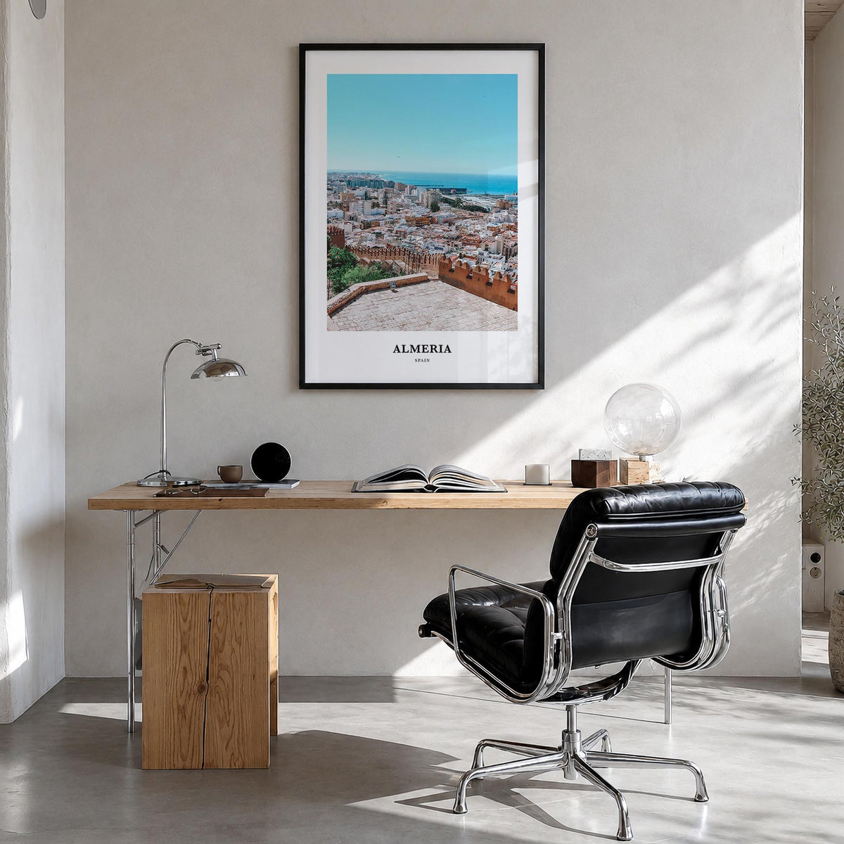 Almería colorful classic poster of Spain – vertical wall art in black wood frame, hanging on wall