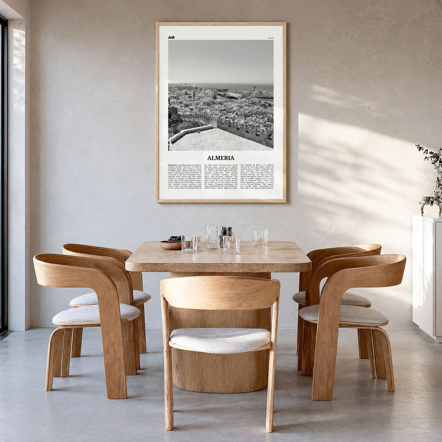 Almería Newspaper Poster in a natural wood frame, hanging in a dining room