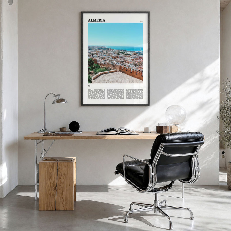 Almería Travel Poster in a black wood frame, hanging in a bright home office