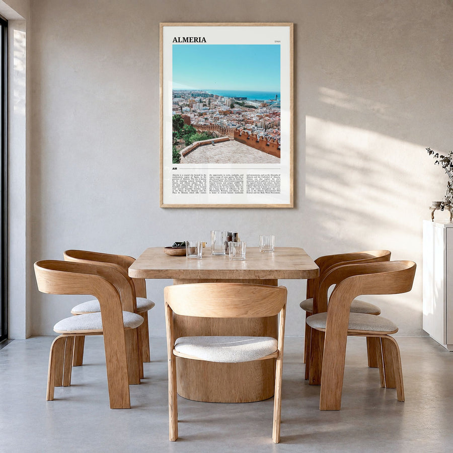 Almería Travel Poster in a natural wood frame, hanging in a dining room