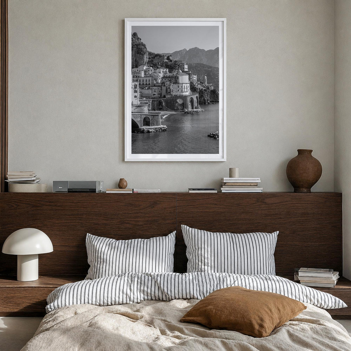 Amalfi black & white photo poster of Italy – vertical wall art in white wood frame with white border, hanging on wall