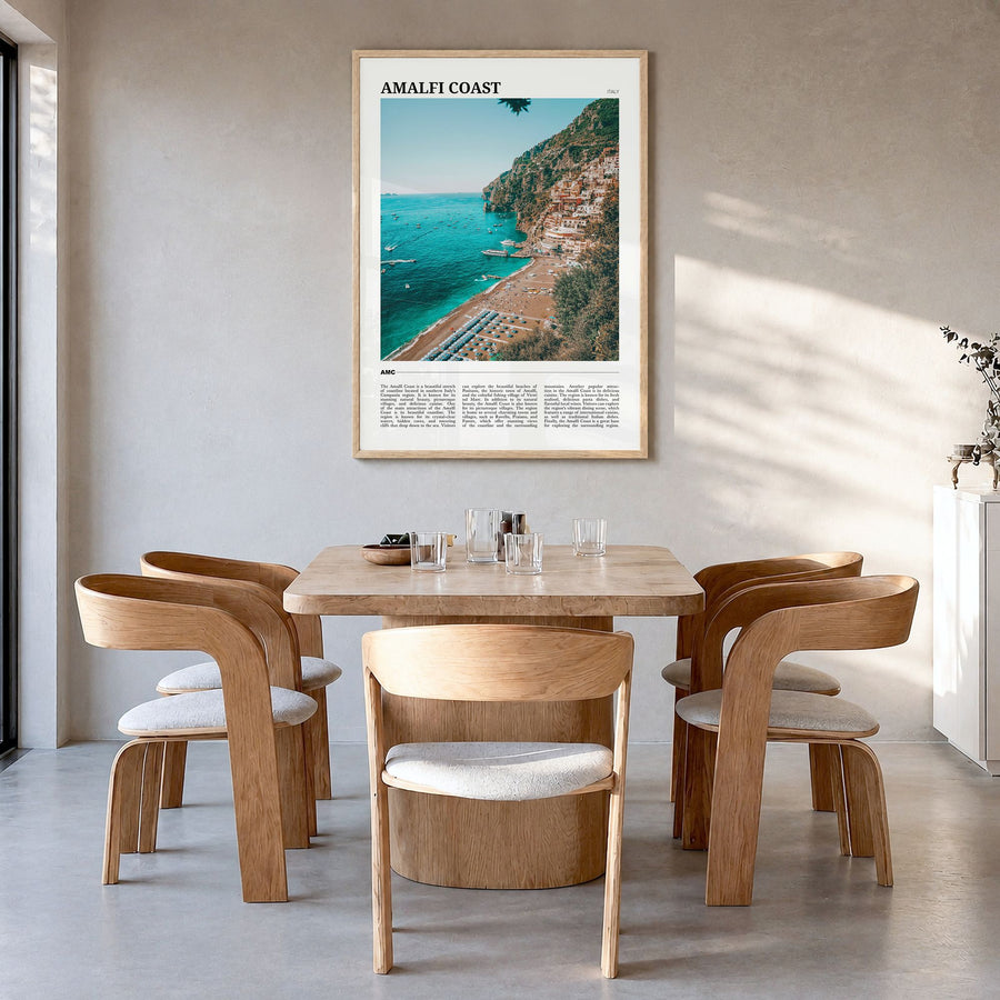 Amalfi Coast Travel Poster in a natural wood frame, hanging in a dining room