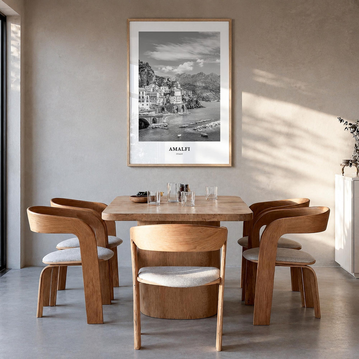 Amalfi no. 1 black & white classic poster of Italy – vertical wall art in natural wood frame, hanging on wall