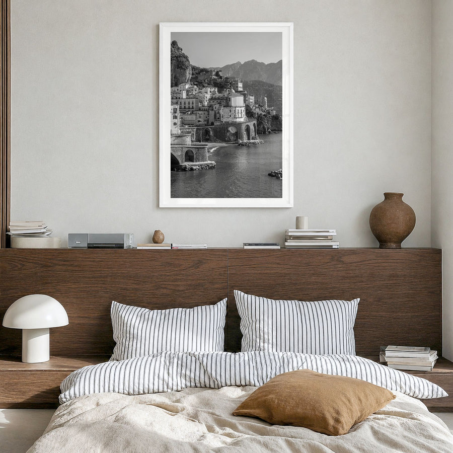 Amalfi Photo Poster in a white wood frame, hanging in a bedroom, white border