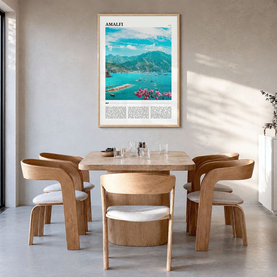 Amalfi Travel Poster in a natural wood frame, hanging in a dining room
