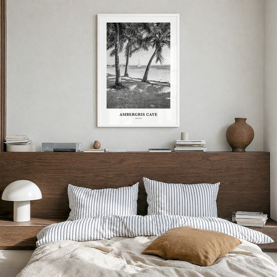 Ambergris Caye Classic Poster in a white wood frame, hanging in a bedroom