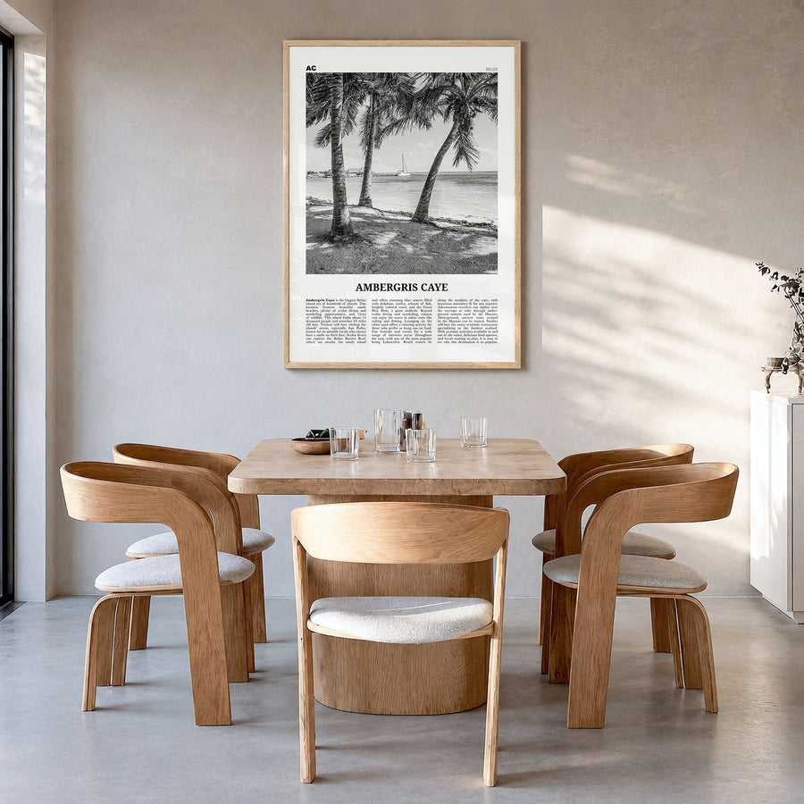 Ambergris Caye Newspaper Poster in a natural wood frame, hanging in a dining room