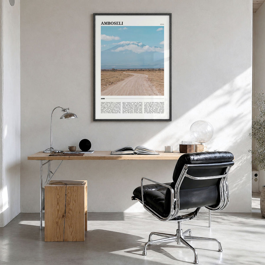 Amboseli Travel Poster in a black wood frame, hanging in a bright home office