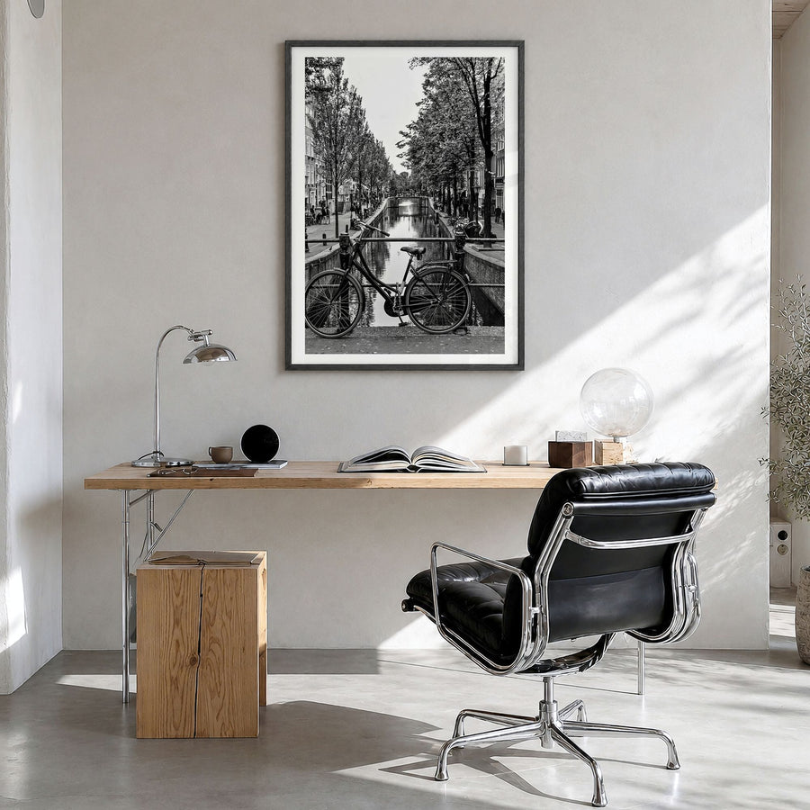 Amsterdam Photo No 3 Poster in a black wood frame, hanging in a bright home office, white border