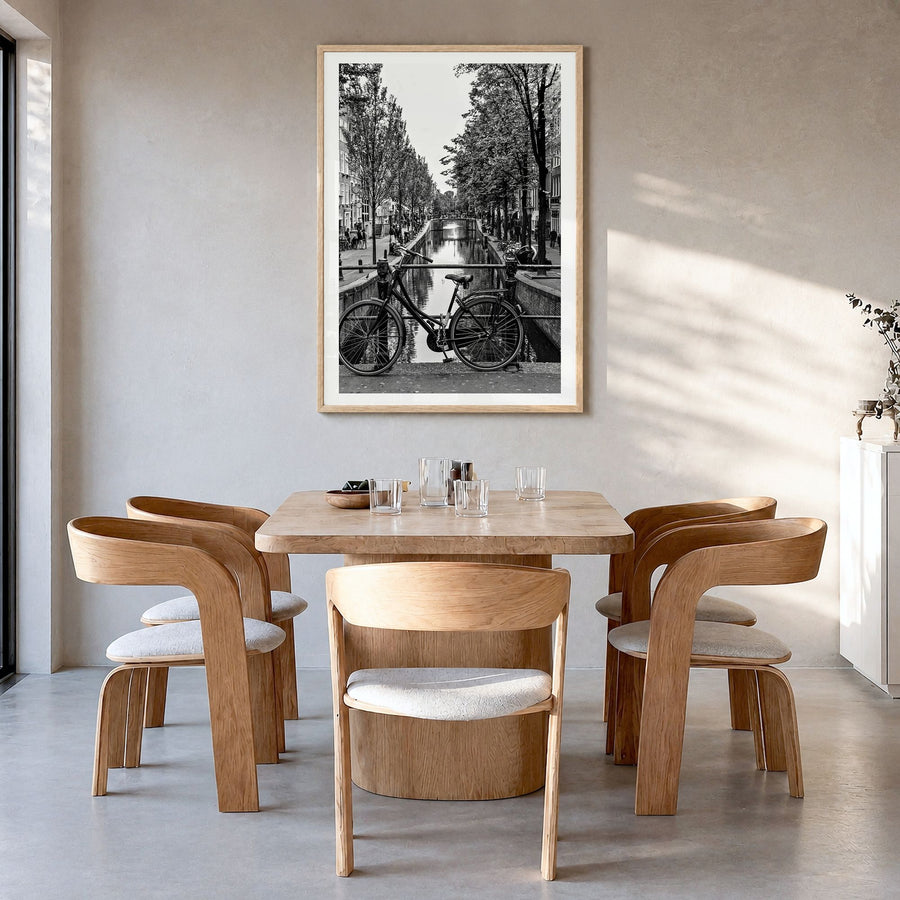 Amsterdam Photo No 3 Poster in a natural wood frame, hanging in a dining room, white border