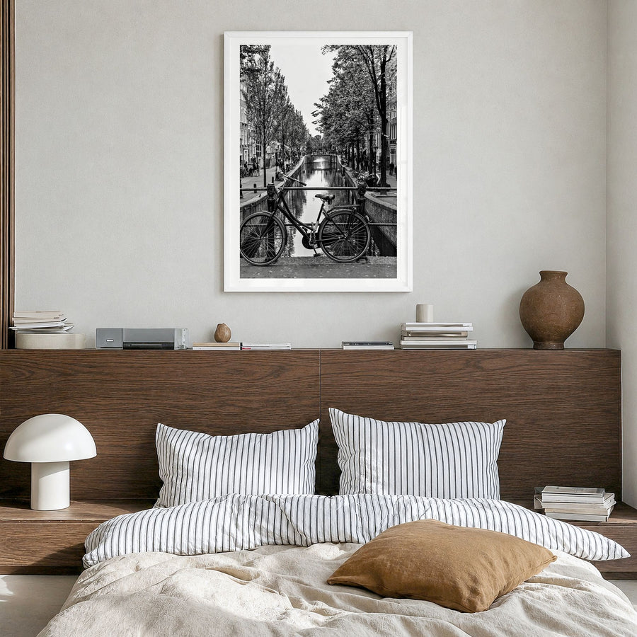Amsterdam Photo No 3 Poster in a white wood frame, hanging in a bedroom, white border