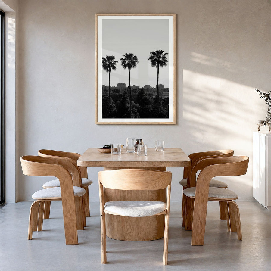 Anaheim Photo Poster in a natural wood frame, hanging in a dining room, white border