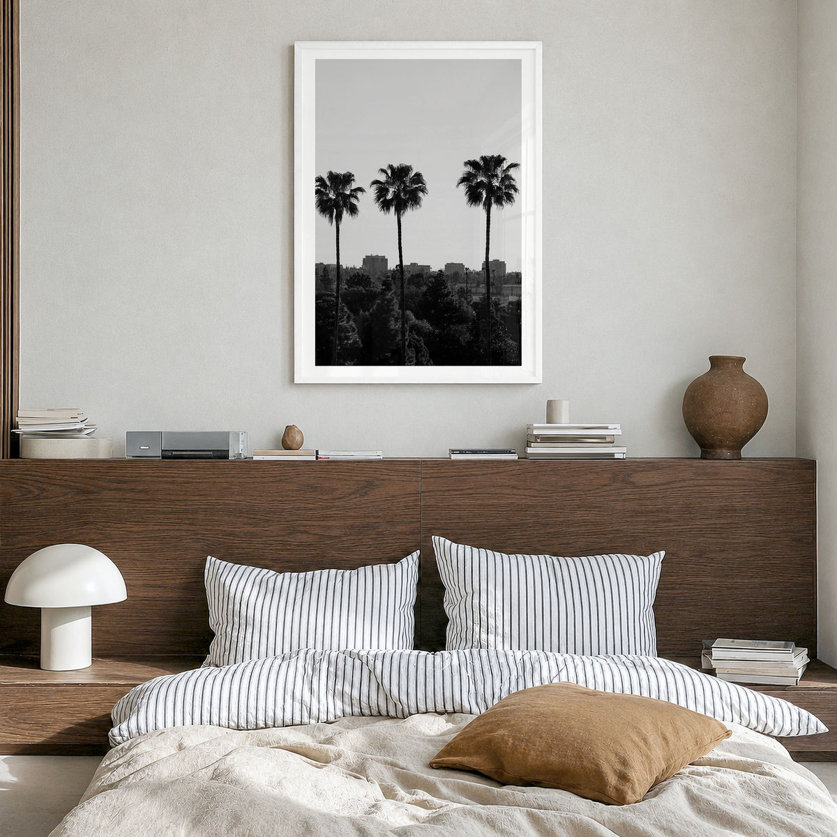 Anaheim Photo Poster in a white wood frame, hanging in a bedroom, white border