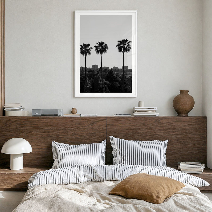 Anaheim Photo Poster in a white wood frame, hanging in a bedroom, white border