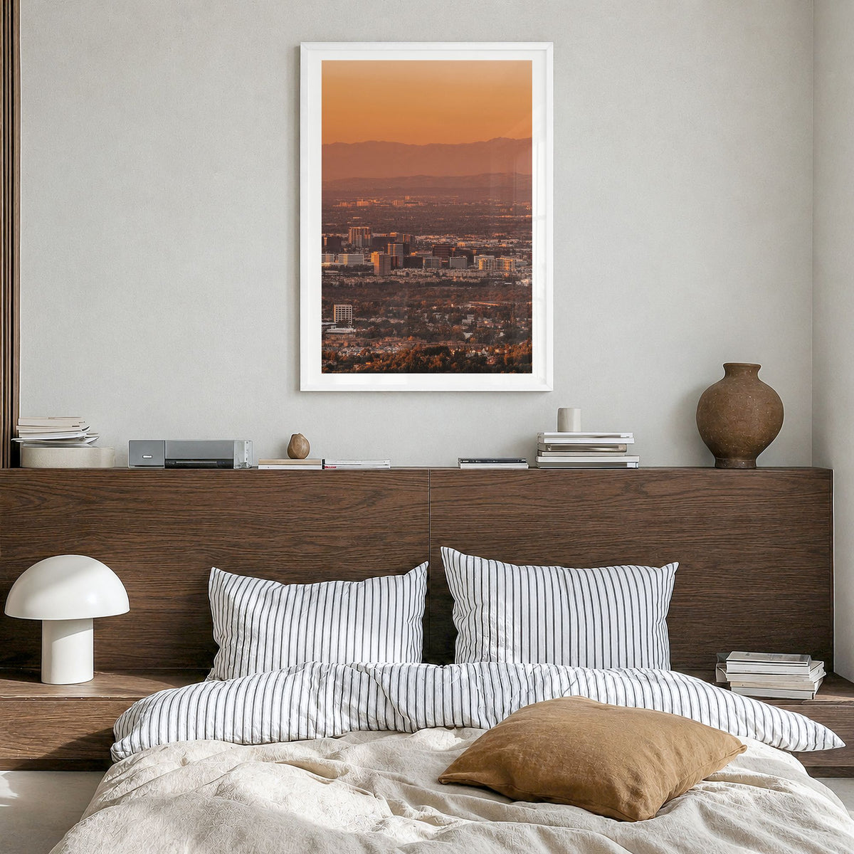 Anaheim Photo Poster in a white wood frame, hanging in a bedroom, white border