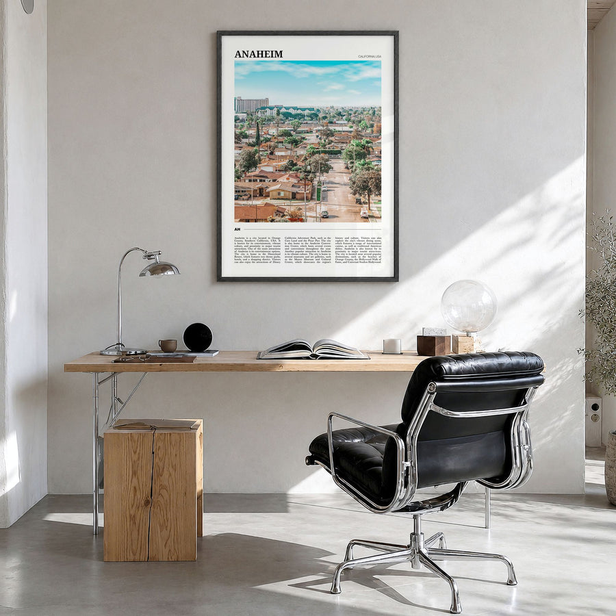 Anaheim Travel Poster in a black wood frame, hanging in a bright home office
