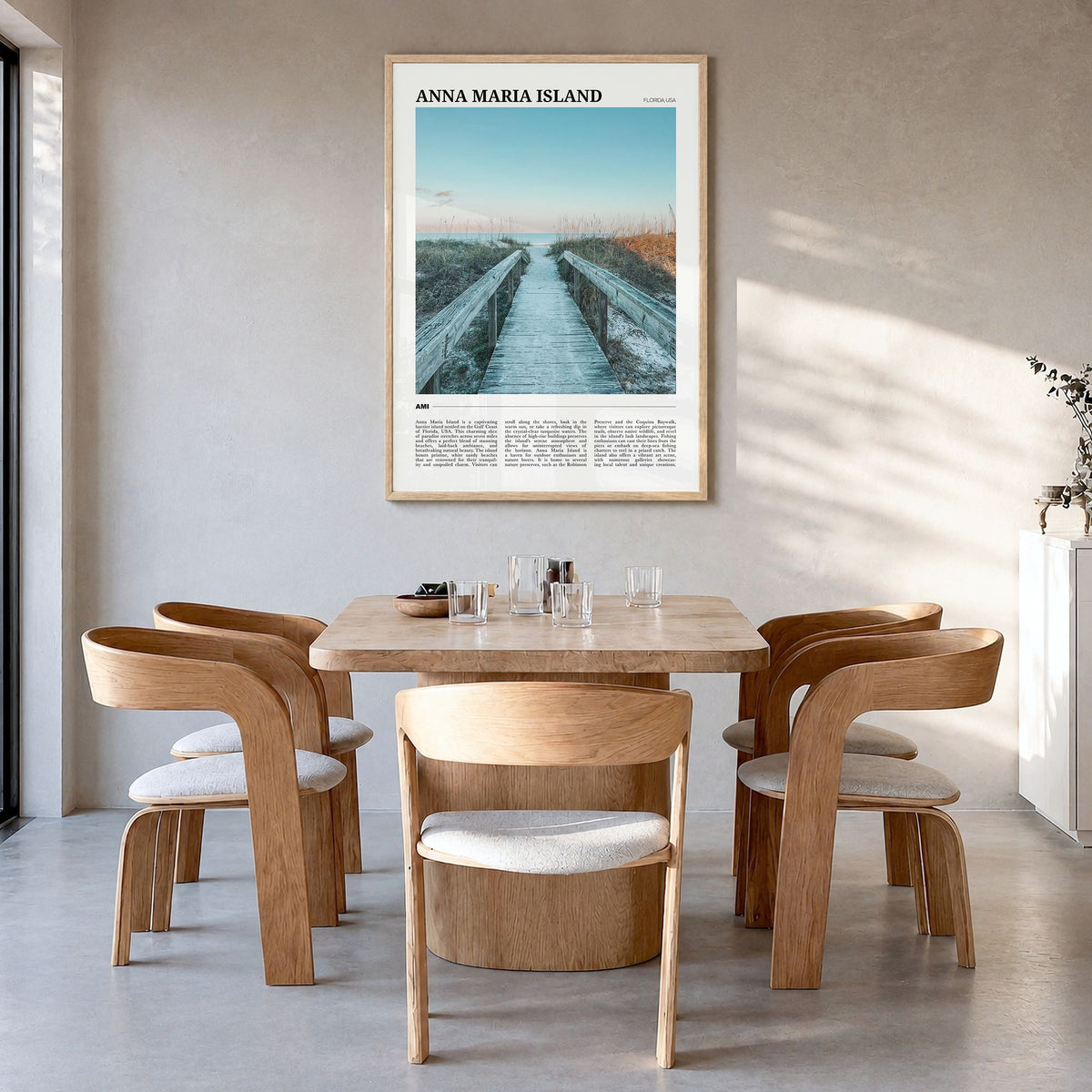 Anna Maria Island Travel Poster in a natural wood frame, hanging in a dining room
