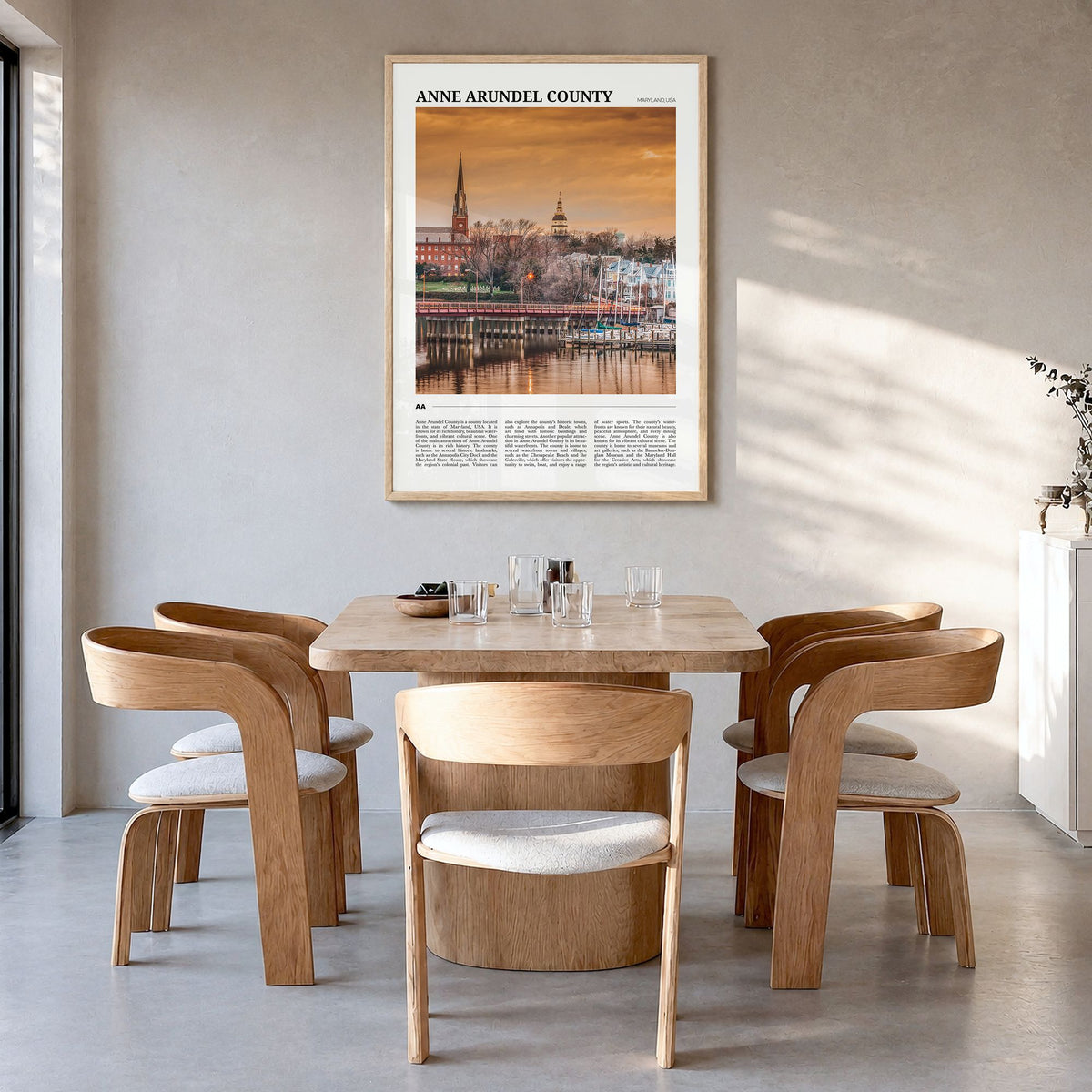 Anne Arundel County Travel Poster in a natural wood frame, hanging in a dining room