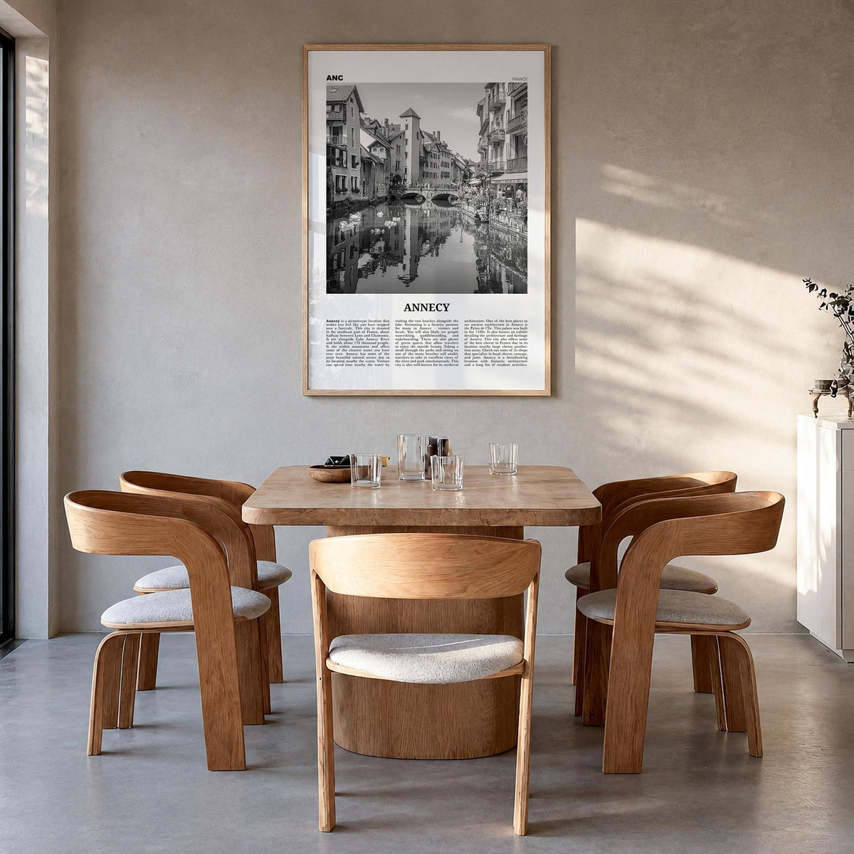 Annecy black & white newspaper poster of France – vertical wall art in natural wood frame, hanging on wall