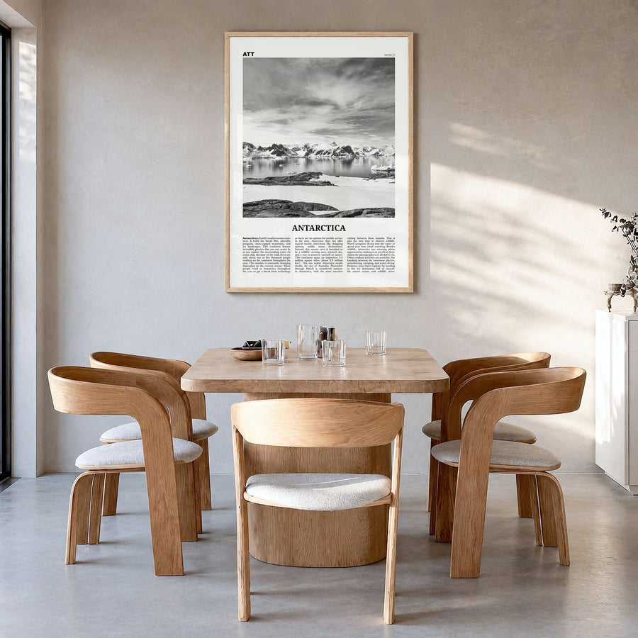 Antarctica Newspaper Poster in a natural wood frame, hanging in a dining room