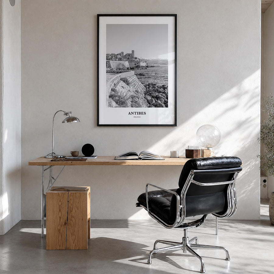 Antibes black & white classic poster of France – vertical wall art in black wood frame, hanging on wall