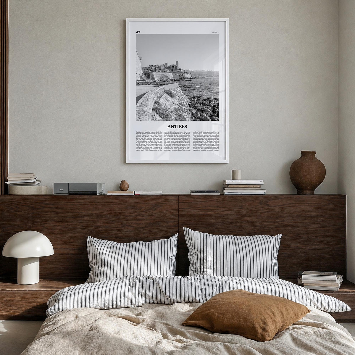 Antibes black & white newspaper poster of France – vertical wall art in white wood frame, hanging on wall