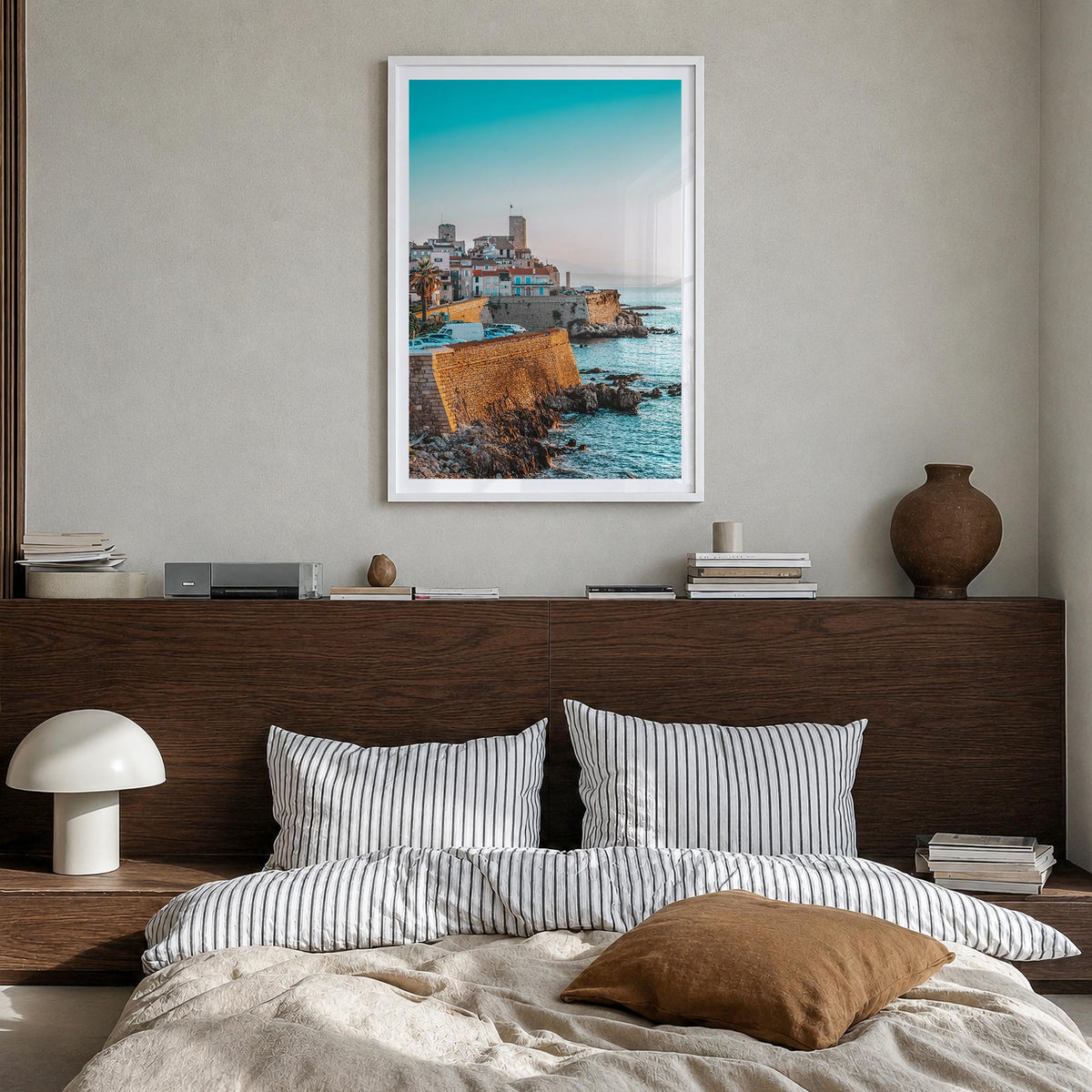 Antibes colorful photo poster of France – vertical wall art in white wood frame with white border, hanging on wall