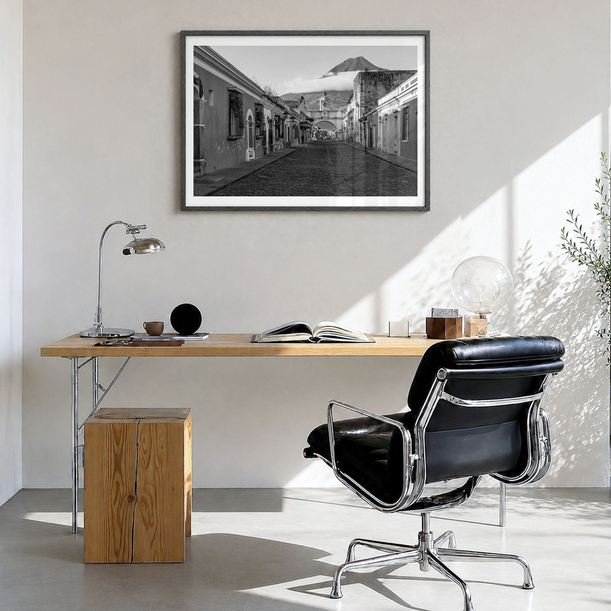 Antigua Guatemala Photo Poster in a black wood frame, hanging in a bright home office, white border