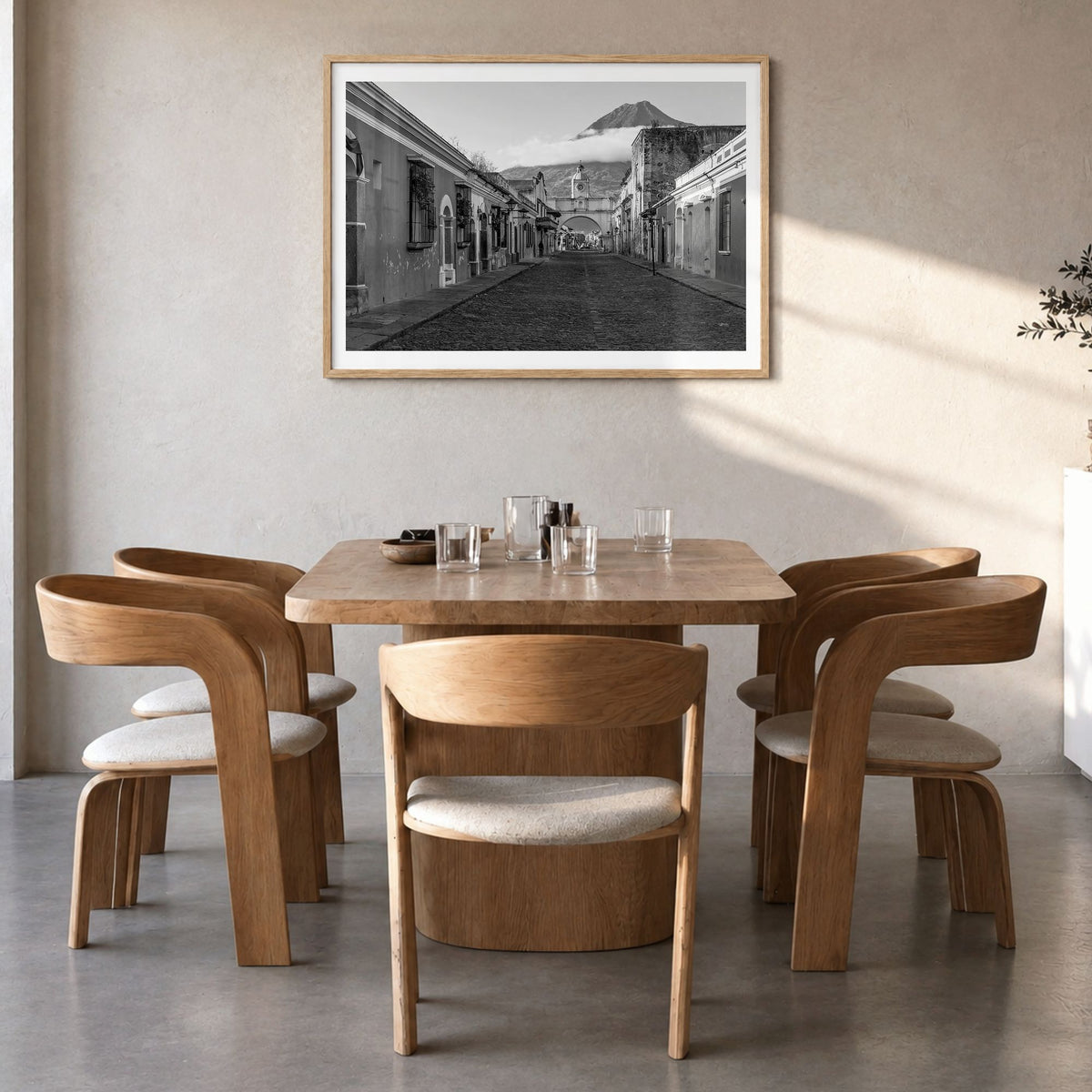 Antigua Guatemala Photo Poster in a natural wood frame, hanging in a dining room, white border