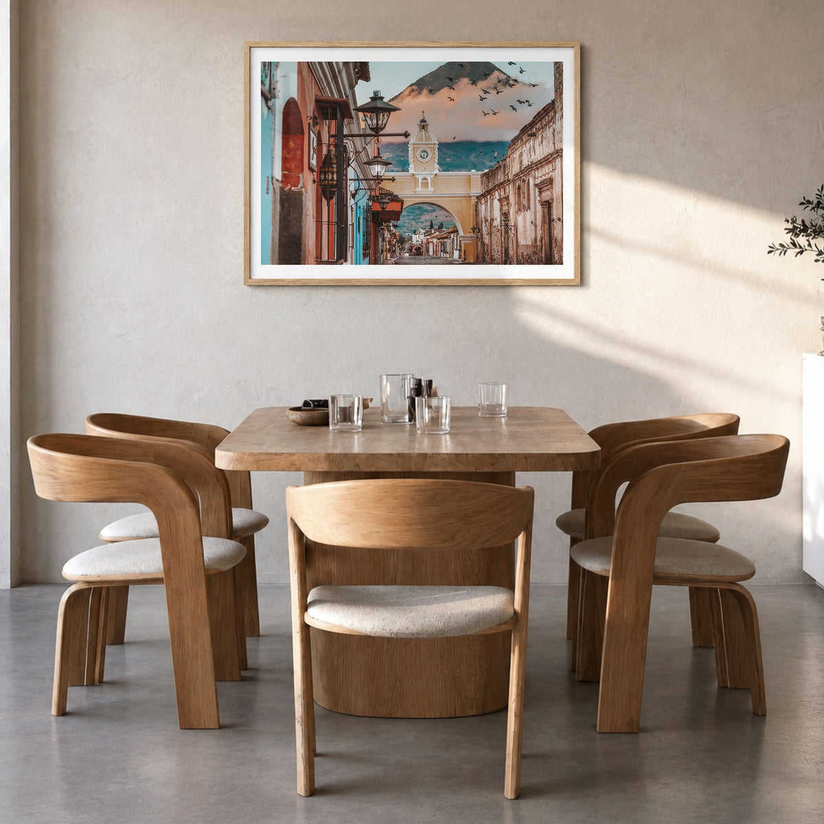 Antigua Guatemala Photo Poster in a natural wood frame, hanging in a dining room, white border