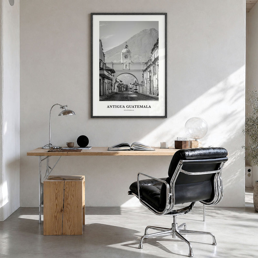 Antigua Guatemala Classic Poster in a black wood frame, hanging in a bright home office