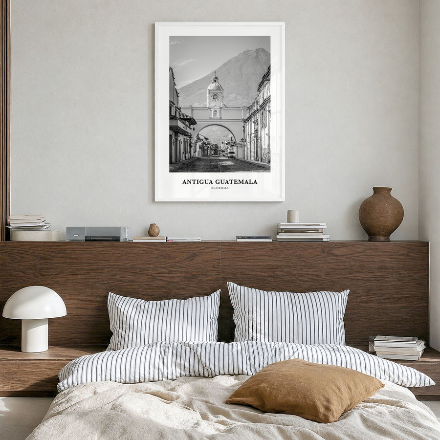 Antigua Guatemala Classic Poster in a white wood frame, hanging in a bedroom
