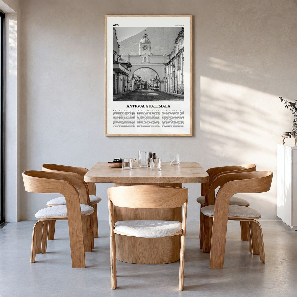 Antigua Guatemala Newspaper Poster in a natural wood frame, hanging in a dining room