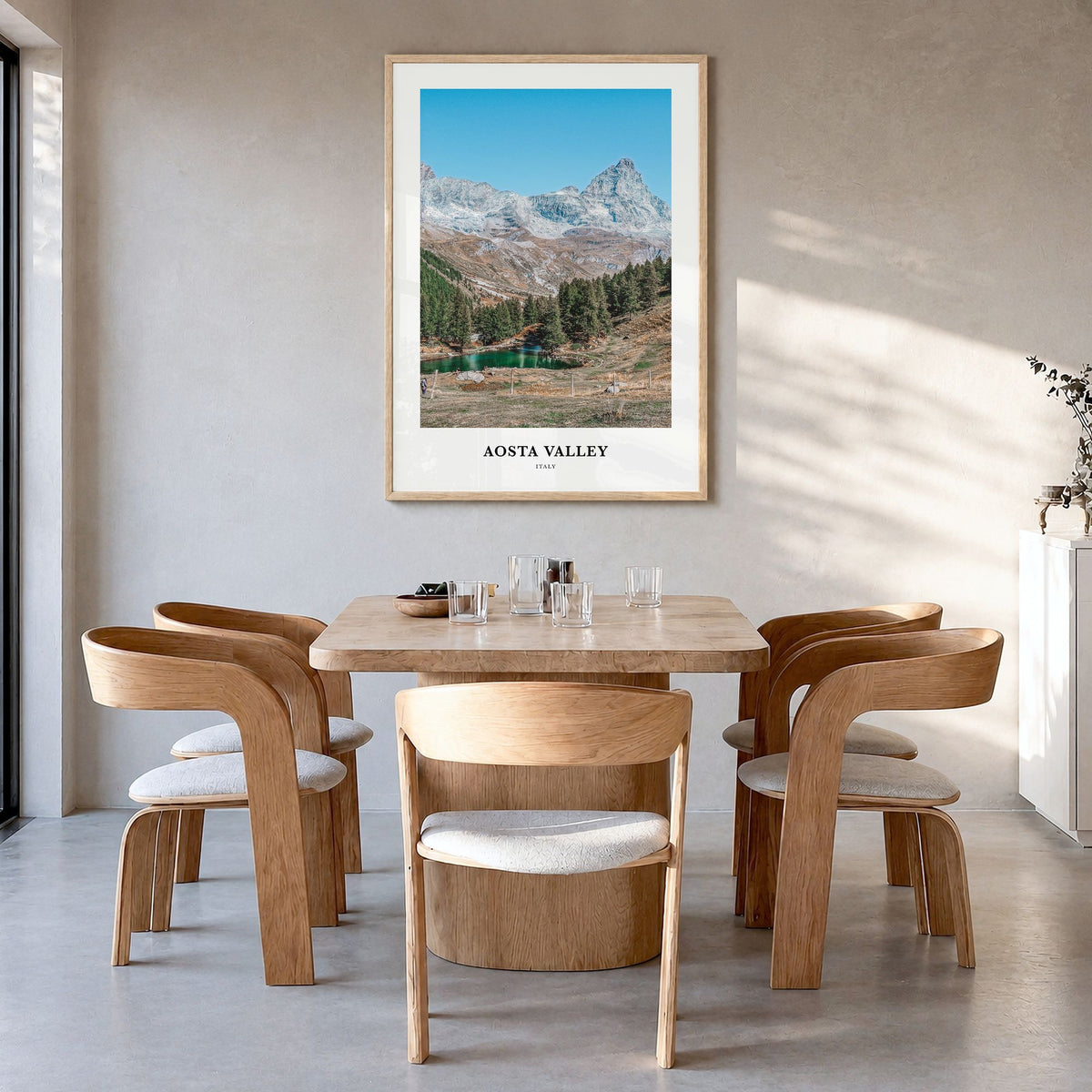 Aosta Valley Classic Poster in a natural wood frame, hanging in a dining room