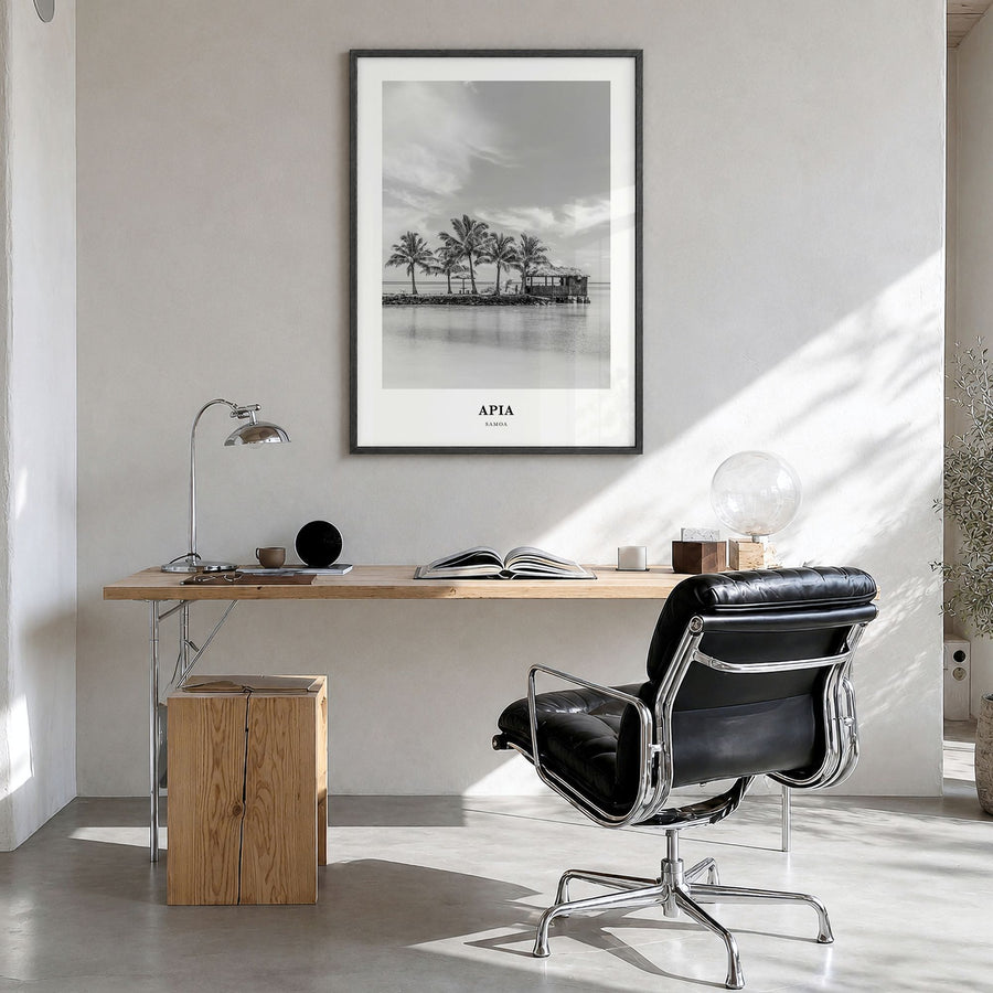 Apia Classic Poster in a black wood frame, hanging in a bright home office