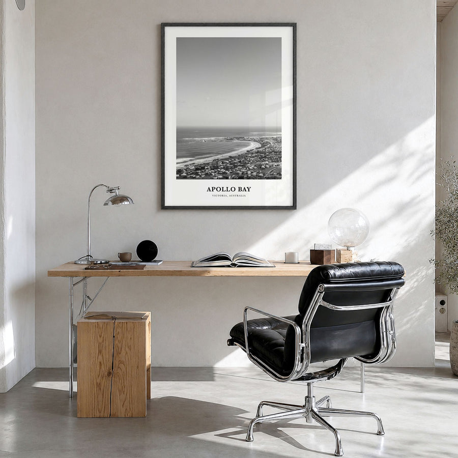 Apollo Bay Classic Poster in a black wood frame, hanging in a bright home office