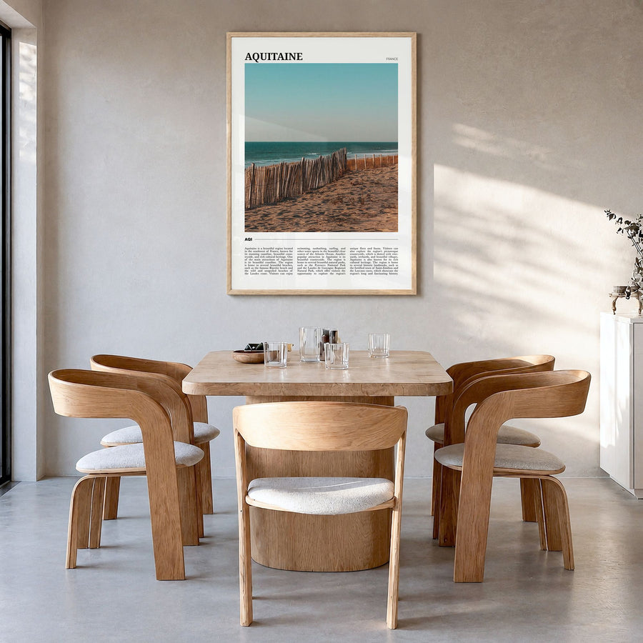 Aquitaine Travel Poster in a natural wood frame, hanging in a dining room